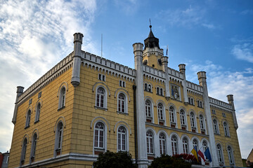 The historic neo-romanesque building of the town hall with a tower in the city of Wschowa