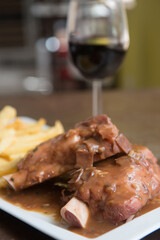 delicious beef knuckle with a glass of wine