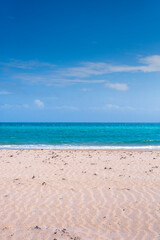 Fototapeta na wymiar Clear blue sky over beach and ocean