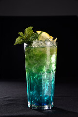 Iced drink with citrus fruits lemon orange alcoholic cocktail martini vodka margerita run tropical fruit juice