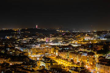 Fototapeta na wymiar Beautiful panoramic aerial view of Lisbon at night, Christ the King, long exposure, Portugal