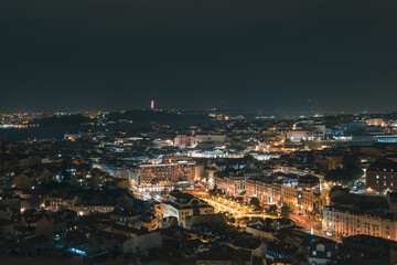 Beautiful panoramic aerial view of Lisbon at night, Christ the King, long exposure, Portugal