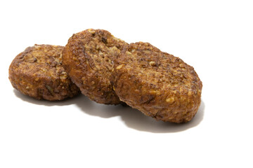 Frikadellen (squashed meatballs) isolated on a white background. German food concept.
