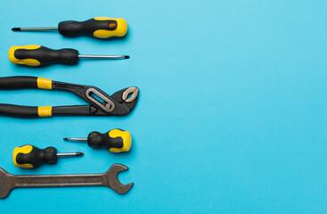 Set of tools on color background, top view