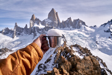 cup full of snow on top of cerro madsen, patagonia argentina