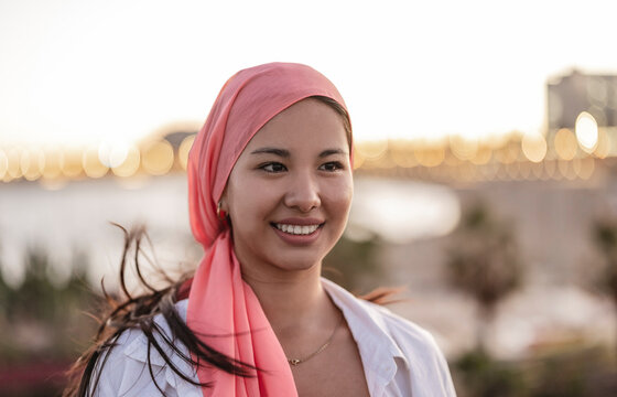 asian woman with cancer pink scarf fight against breast cancer