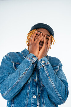 Cheerful black man in denim jacket
