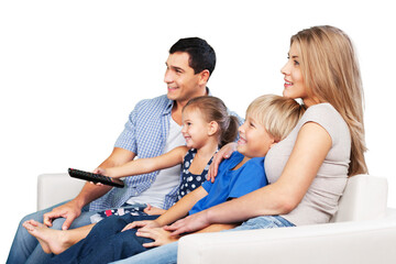 Beautiful smiling family watching TV at home
