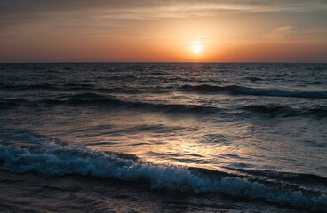 Sunset over the Mediterranean sea, waves