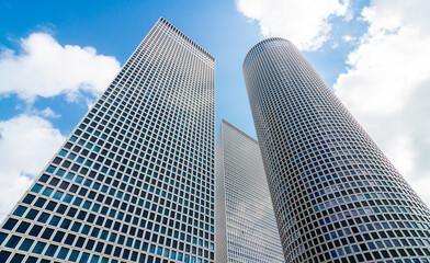 Fototapeta na wymiar Tel Aviv downtown of city: azrieli towers and blue sky, bottom-up view