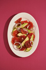 spring salad with avocado, blood orange and onion