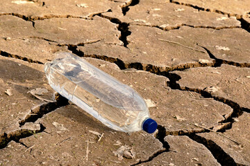 A bottle of water on the dried ground.
The concept of thirst, dehydration.- 574036353