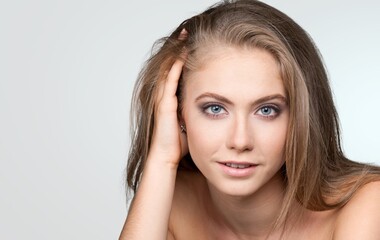 Obraz premium Happy young woman after facial treatment.