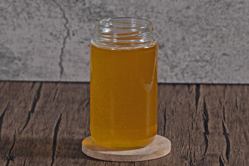 Home made clarified butter or also called as Ghee in storage glass container
