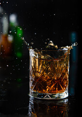Explosion in a glass of whiskey in a fancy bar