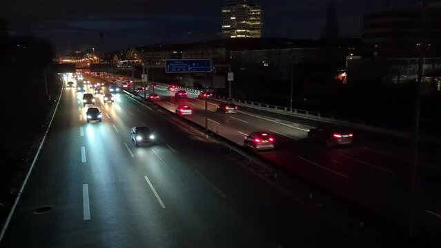 Berlin city motorway A100 in rush hour in the evening with lights and moving traffic