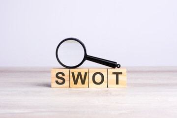 SWOT word made with wooden blocks. can be used for business, marketing and education concept