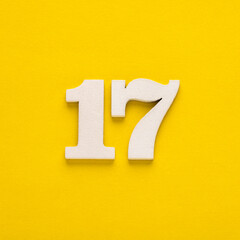 Number 17 on a yellow background - Two-digit number in white