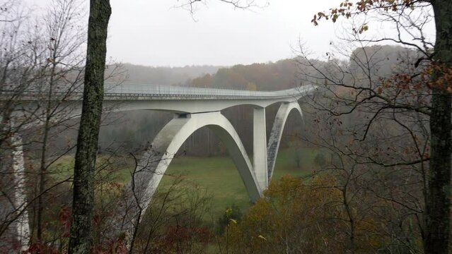Natchez Trace Parkway Double Arch Bridge over Birdsong Hollow in Tennessee. Overlook with autumn foliage. 