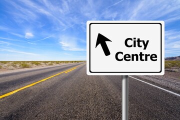 Road sign of city center on sky and road  background