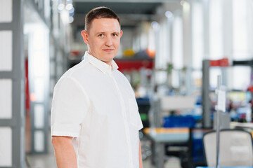 a man in a white shirt in the office. the portrait of an entrepreneur. career.