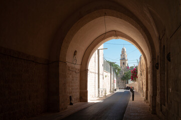 Jerusalem: narrow streets of Old City, arches, tower of Abbey of the dormition
