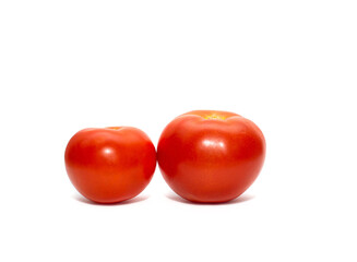 Tomatoes on a white isolated background. The concept of eating vegetables and fruits, taking care of your physical condition and diet.