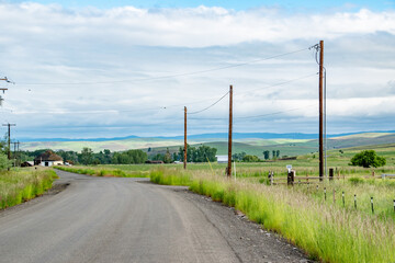 Fototapeta na wymiar Dirt Country Road in Enterprise, OR in Rural Eastern Oregon