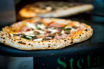 Pizza napoletana in preparation by pizzaiolo