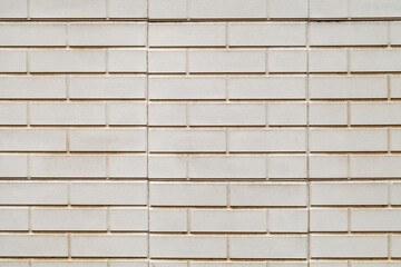 Decorative beige brickwork, background wallpaper, uniform texture pattern