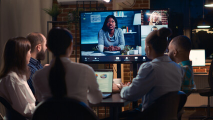 Employees discussing presentation with remote team in videocall app, coworkers brainstorming in...