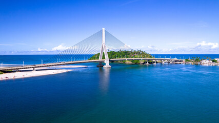 Fototapeta premium Aerial view of Ilheus, tourist town in Bahia. Historic city center with famous bridge in the background.