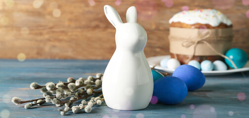 Naklejka na ściany i meble Ceramic bunny, Easter eggs and pussy willow branches on wooden table