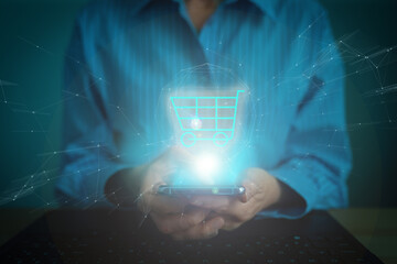 Online marketing commerce sale concept. Woman hold basket online shopping hologram virtual screen