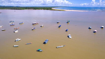 Aerial view of Itacare beach, Bahia, Brazil. Village with fishing boats and vegetation