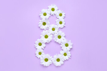 Figure 8 made of chamomile flowers on lilac background. Women's Day celebration