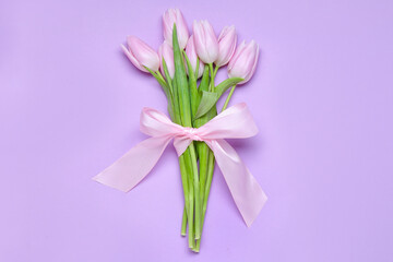 Bouquet of beautiful tulip flowers on lilac background. Women's Day celebration