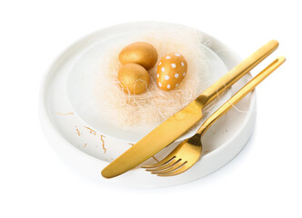 Stylish table setting with Easter eggs and golden cutlery on white background