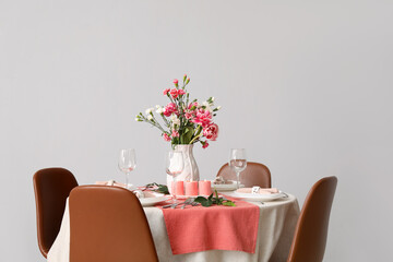 Beautiful table setting for International Women's Day celebration in light room