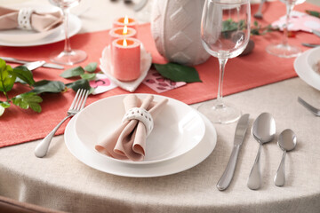 Beautiful setting for International Women's Day celebration with cutlery and napkin on table
