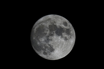 Obraz na płótnie Canvas The full moon against dark night sky