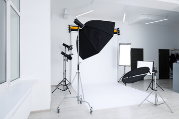 Interior of modern photo studio with professional lighting equipment
