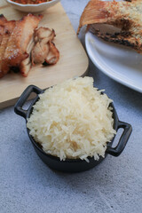 Sticky rice eating with sweet pork grilled and and papaya salad. Traditional asian food. Thai cuisine is so yummy.