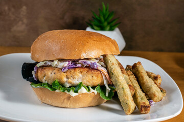 salmon burger top with cole slaw