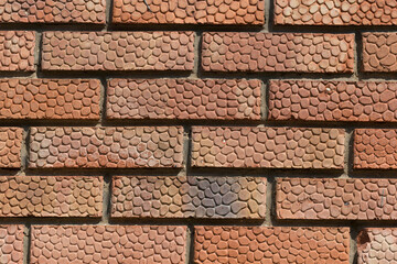 Burnt brick. Wall with rough brickwork.