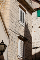 Picturesque narrow street with stone houses. Trogir, Dalmatia, Croatia, Europe