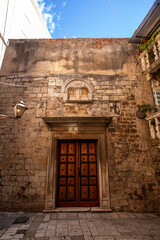 Picturesque narrow street with stone houses. Trogir, Dalmatia, Croatia, Europe