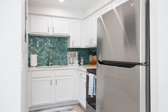 Green tiled small kitchen in vacation rental, Cape Canaveral, Florida