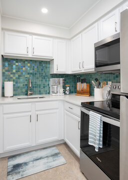 Green tiled small kitchen in vacation rental, Cape Canaveral, Florida