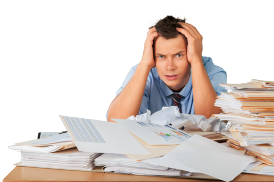 Tired young businessman with many business papers